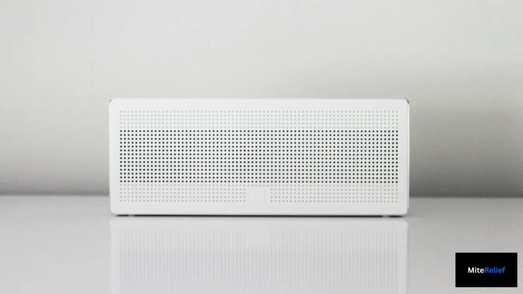 Dehumidifier lowering bedroom humidity below 50% to prevent dust mite growth