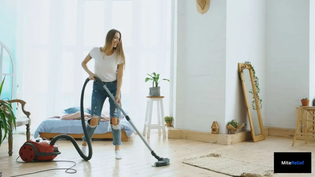 Vacuuming a bedroom to reduce dust mite allergens and allergy symptoms